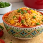 Bowl of vibrant Sassy Rice with vegetables and garnishes.