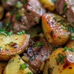 Garlic butter steak bites and roasted potatoes with herbs.