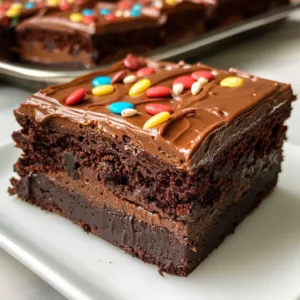 Close-up of a stack of fudgy chocolate chip brownies, with a bite taken out of the top one.