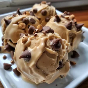 Close-up of several frozen Greek yogurt peanut butter bites topped with chocolate chips.
